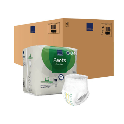 A large cardboard shipping box, a pack of Abena Pants Premium Protective Adult Underwear (size L3, 15 pieces), and one unfolded pull-up standing upright in front of the pack.