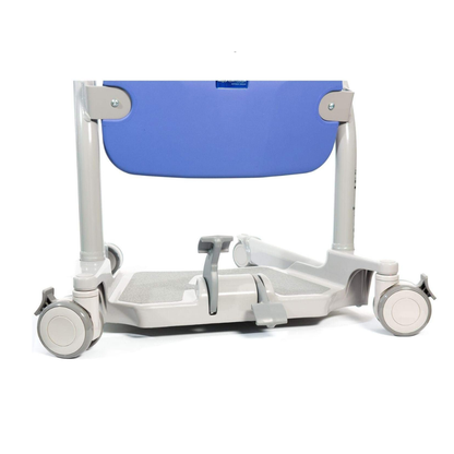 A close-up of the ARJO Sara Stedy Manual Standing Aid & Sit-To-Stand Transfer Lift shows its gray wheels, blue backrest, and footrests—designed for easy mobility and support during patient transfers.