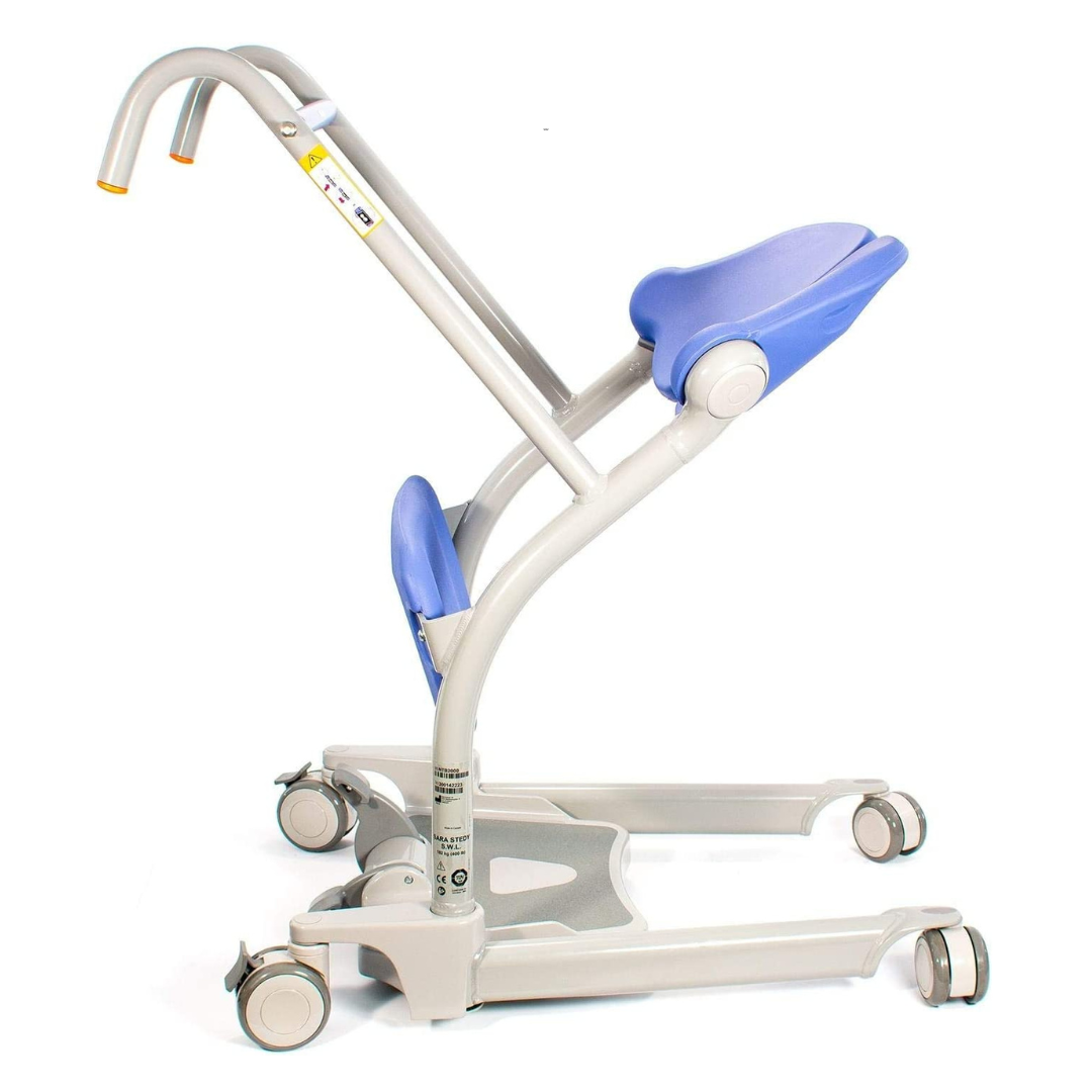 The ARJO Sara Stedy Manual Standing Aid & Sit-To-Stand Transfer Lift features a sturdy metal frame, four caster wheels, a blue padded seat, and knee support for easy movement and optimal patient mobility assistance.