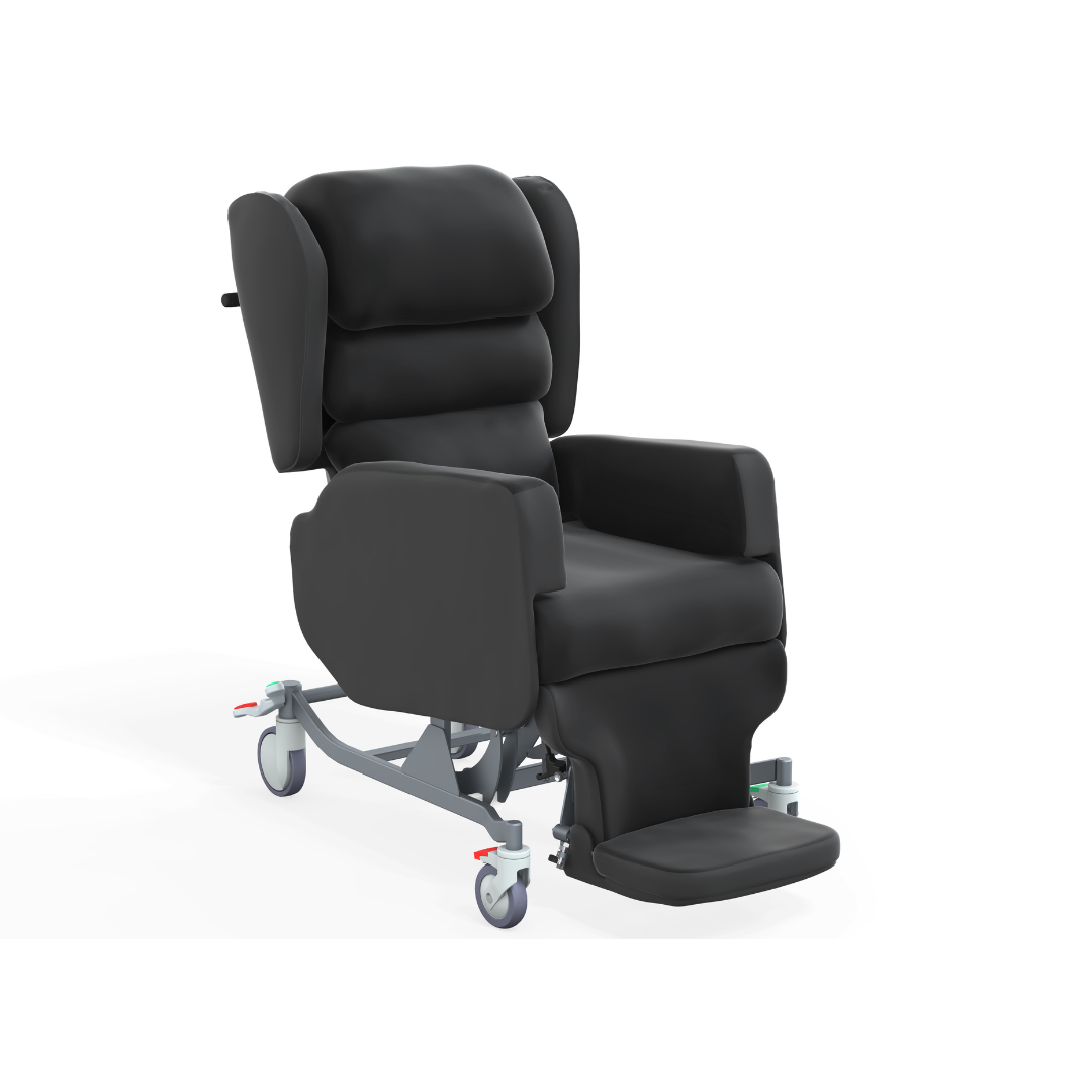 The Accora Configura® Advance Postural Tilt Chair is a black, cushioned chair with armrests, high back, wheeled base, and extended footrest—designed for mobility and patient comfort.