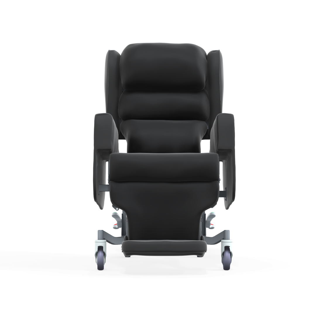 The Accora Configura® Advance Postural Tilt Chair is a black padded medical recliner with armrests, leg rest, and wheels, shown from the front on a white background—designed for comfort, mobility, and adaptable postural support.