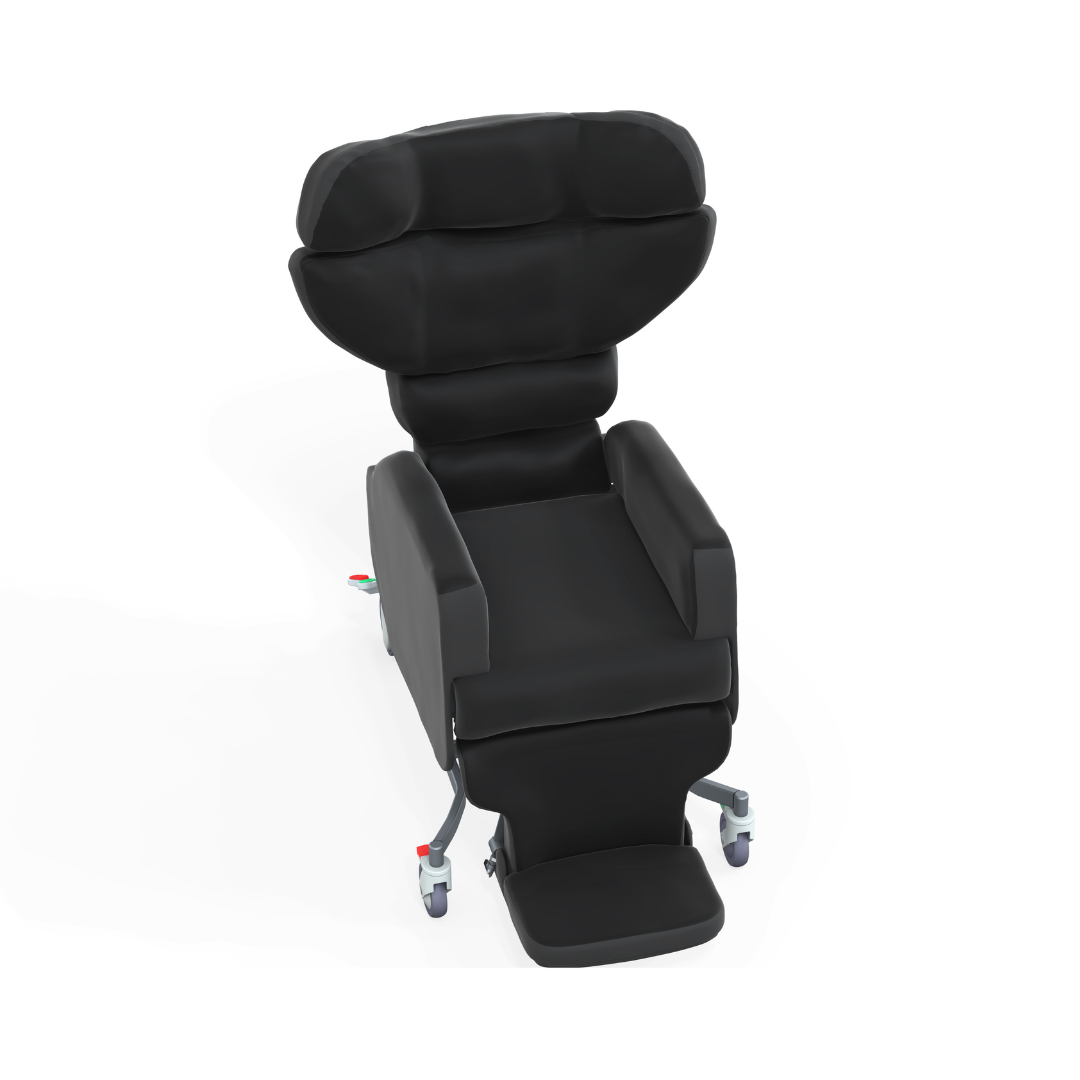 The Accora Configura® Advance Postural Tilt Chair is a black padded chair with adjustable headrest, armrests, and footrest on wheels, shown against a white background. It provides adaptable postural support for medical or therapy needs.