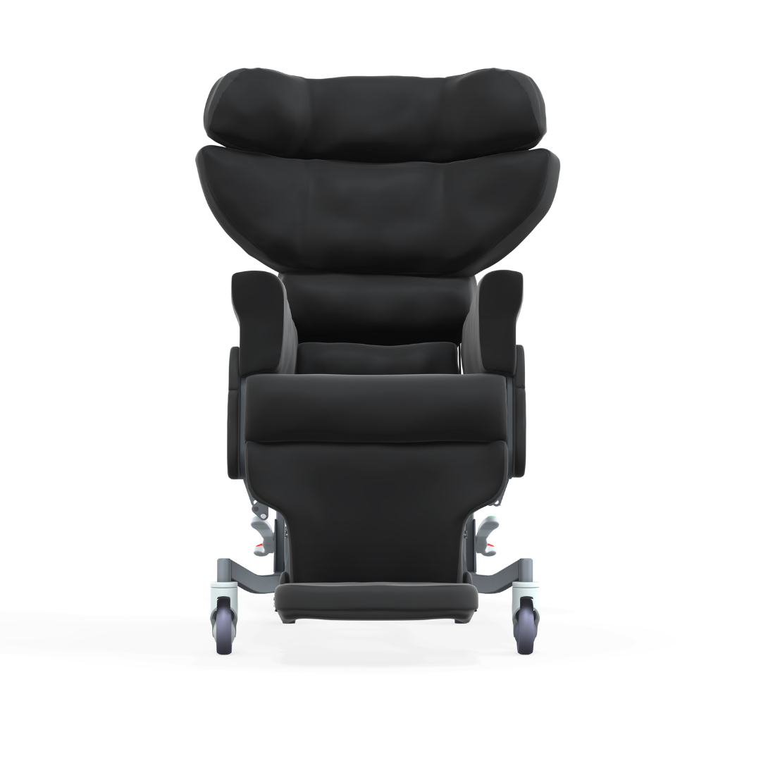 The Accora Configura® Advance Postural Tilt Chair is a modern black high-back recliner with armrests, head support, and four caster wheels, designed for adaptable postural care and shown from the front against a white background.