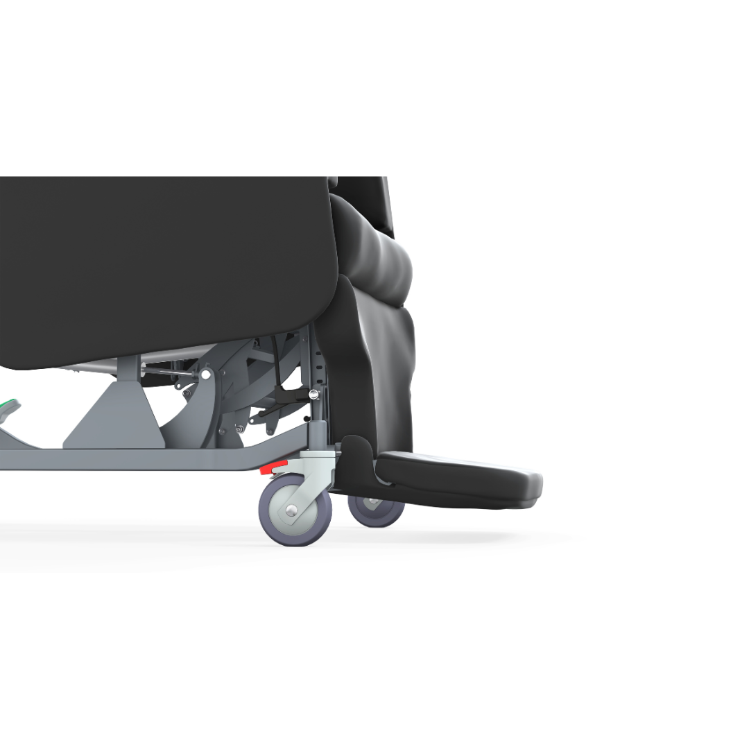 Close-up of the lower side of the Accora Configura® Advance Postural Tilt Chair, featuring a wheel with a red brake lever and an extended footrest, set against a white background.