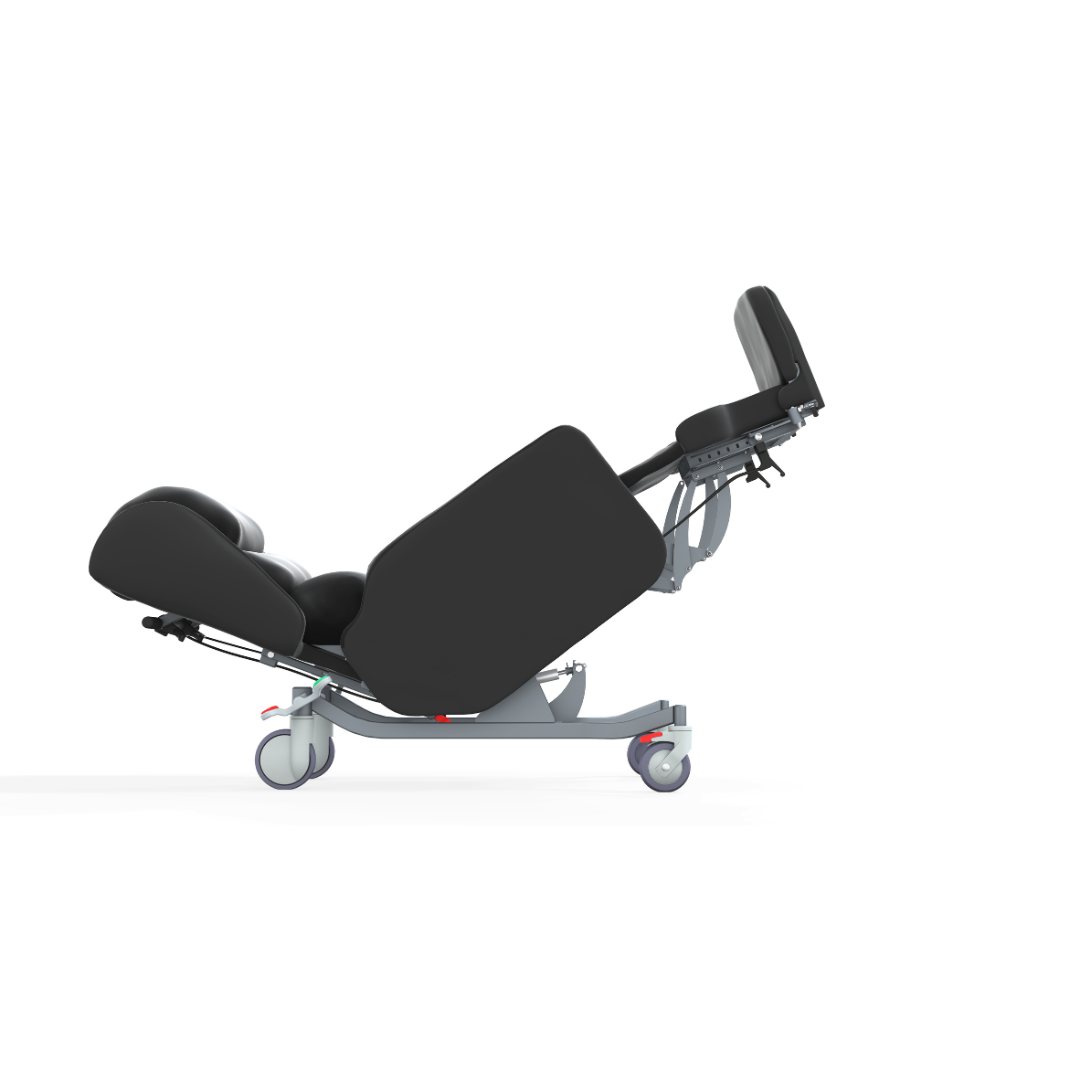 The Accora Configura® Advance Postural Tilt Chair is a contemporary, versatile chair with black cushions, adjustable leg and back support, and a robust wheeled frame, pictured partially reclined against a white background.