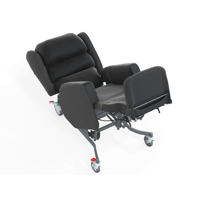 A black Accora Configura® Advance Postural Tilt Chair with elevated leg rests, wheels, and red brake levers is seen at an angle, partially reclined. It features armrests and offers adaptable support for secure positioning.