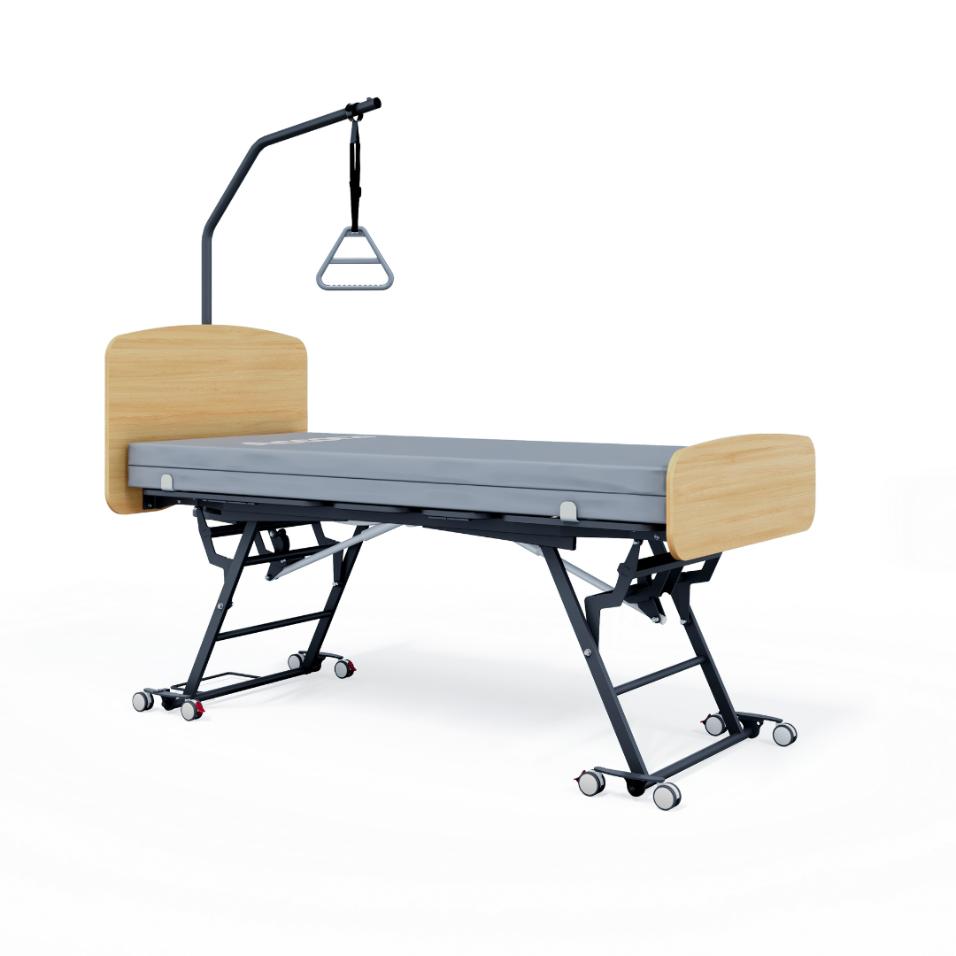 The Accora Contesa® FloorBed® Hi/Low Full Electric Bed features a light wood headboard and footboard, gray mattress, black wheeled metal frame, and overhead trapeze bar—an ideal fall-prevention solution for patient mobility and safety.