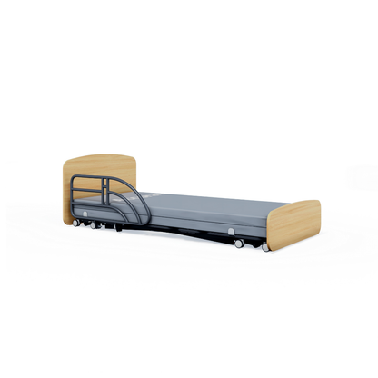 An Accora Contesa® FloorBed® Hi/Low Full Electric Bed with light wood head/footboards, grey mattress, single metal safety rail, and wheels—an ideal fall-prevention solution shown on a plain white background.