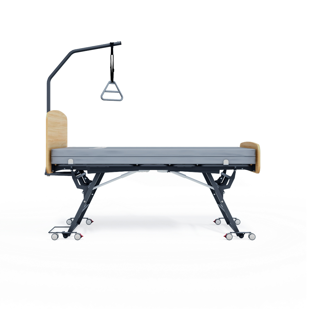The Accora Contesa® FloorBed® Hi/Low Full Electric Bed features adjustable height, wheels, wooden head and footboards, and an overhead trapeze for patient support—a fall-prevention solution pictured on a white background.