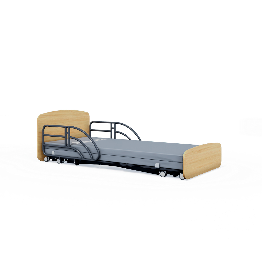 The Accora Contesa® FloorBed® Hi/Low Full Electric Bed features a light wood headboard and footboard, gray mattress, black safety rails on one side, wheels for mobility, and offers an effective fall-prevention solution.