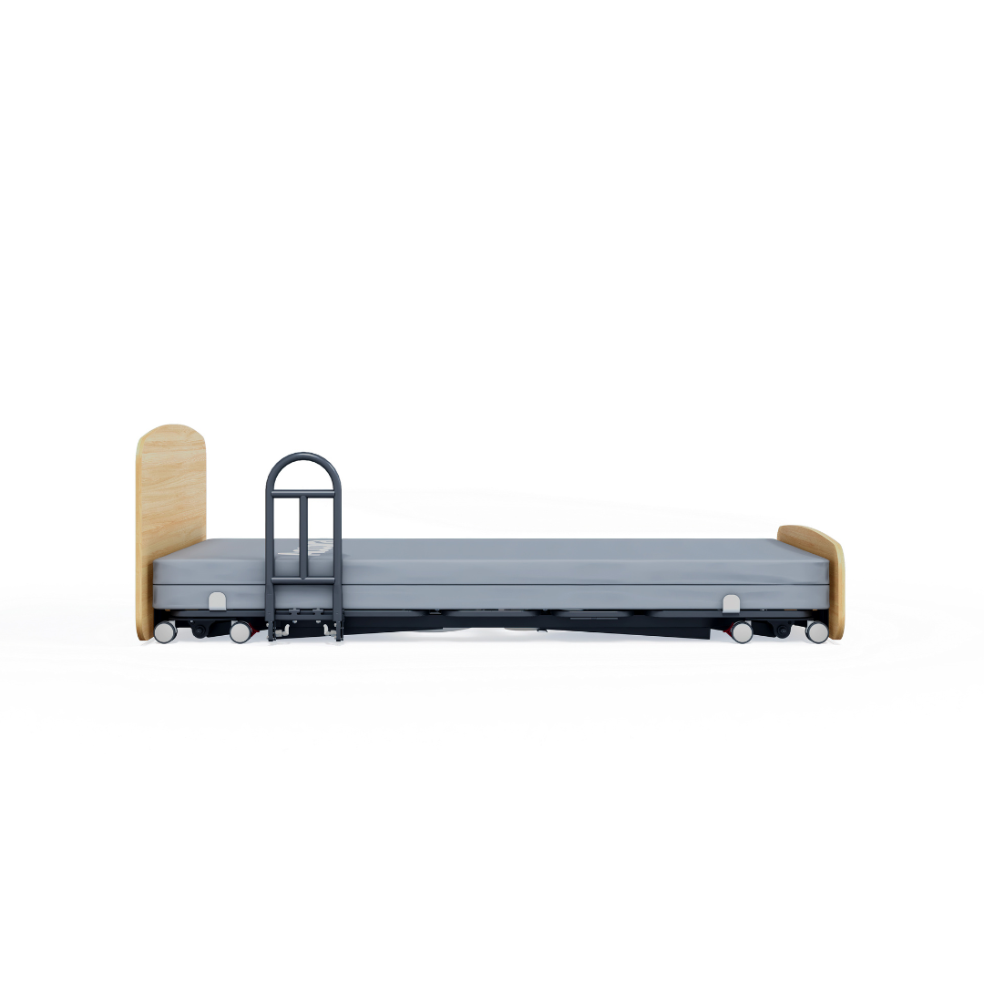 The Accora Contesa® FloorBed® Hi/Low Full Electric Bed, shown with a light wood headboard and footboard, gray mattress, black side rails, and wheels on a white background, provides an effective fall-prevention solution for patient safety.
