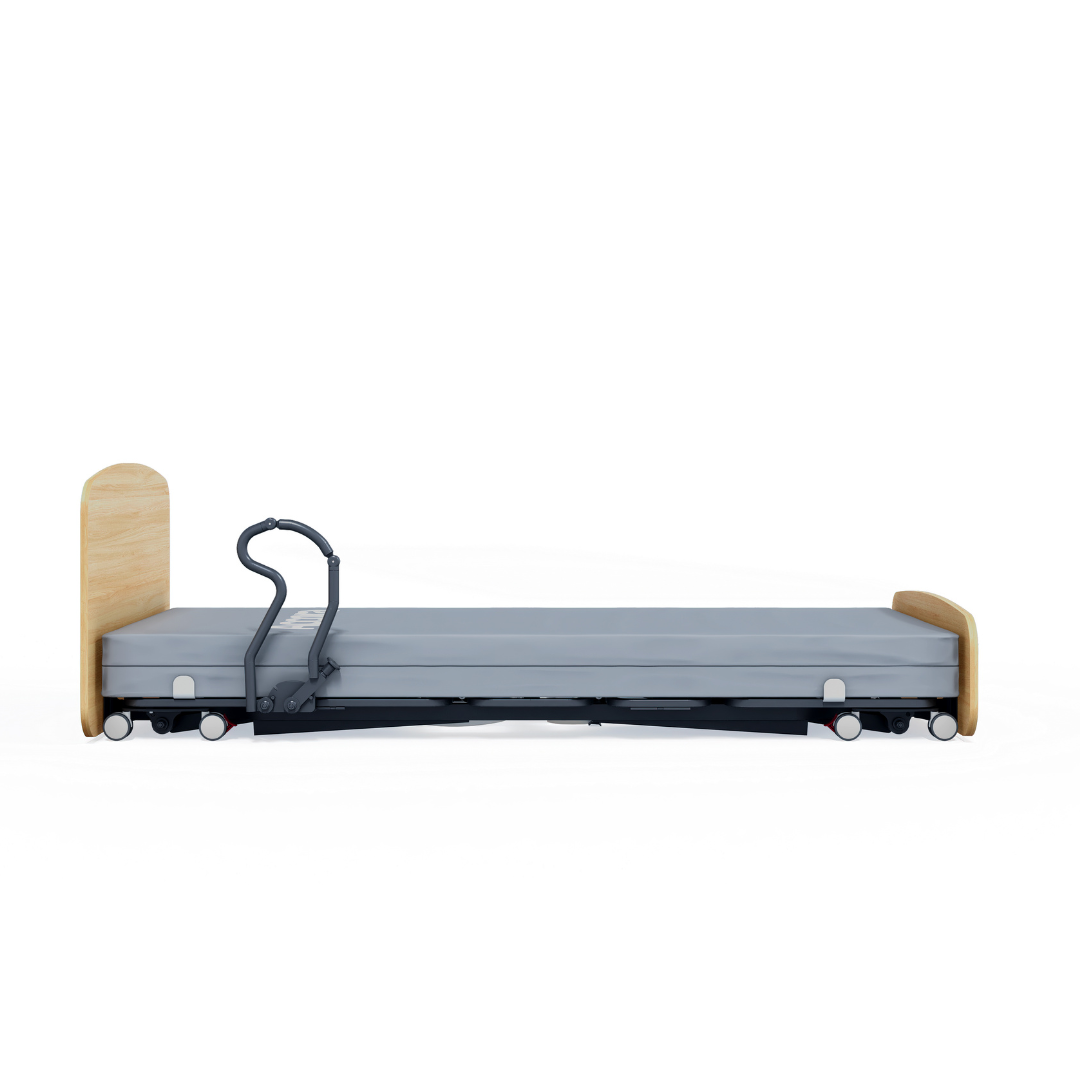 The Accora Contesa® FloorBed® Hi/Low Full Electric Bed is a modern, low-profile hospital bed for fall prevention, with a wooden headboard and footboard, gray mattress, and one black safety rail, shown from the side on a white background.