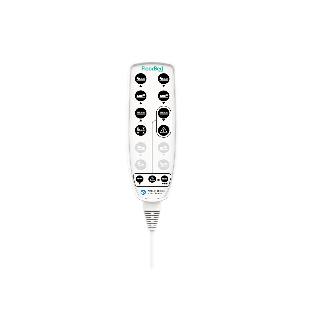 A white handheld remote control for the Accora Empresa® Full Electric Bariatric FloorBed® with labeled black buttons and various icons is shown attached to a cord on a white background.