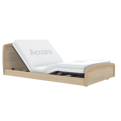 The Accora Empresa® Full Electric Bariatric FloorBed® features a partially elevated backrest, combining white and wood accents for enhanced style and comfort in patient care.