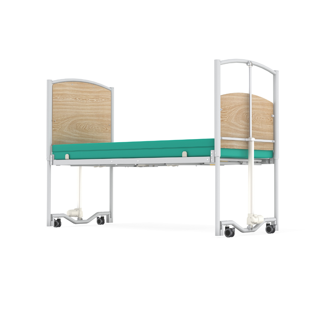 A hospital bed with light wood head and footboards, a green mattress, metal frame, and leg casters, viewed from the foot end against a white background—an Accora FloorBed® Ultra Low Full Electric Homecare Bed.