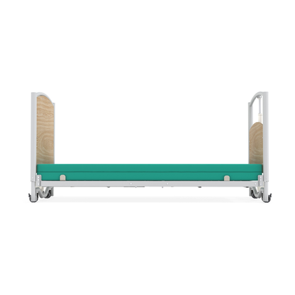 The Accora FloorBed® Ultra Low Full Electric Homecare Bed features a teal mattress, light wood headboard and footboard panels, and white metal rails, shown from the side on a white background.