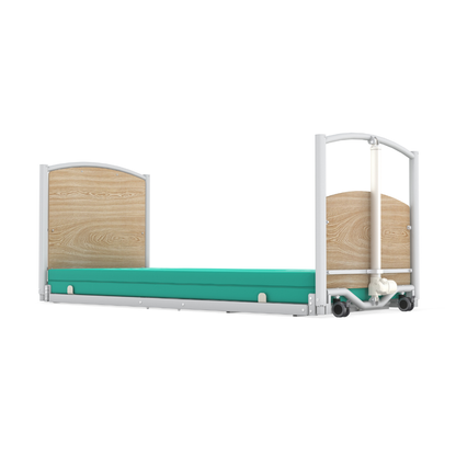 The Accora FloorBed® Ultra Low Full Electric Homecare Bed features a light wood headboard and footboard, green mattress, and white metal frame—an ultra low bed ideal for medical or home care use.