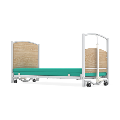 A hospital bed with a metal frame, light wood headboard and footboard, green mattress, and wheels—shown on a white background—resembles the Accora FloorBed® Ultra Low Full Electric Homecare Bed designed for enhanced safety.