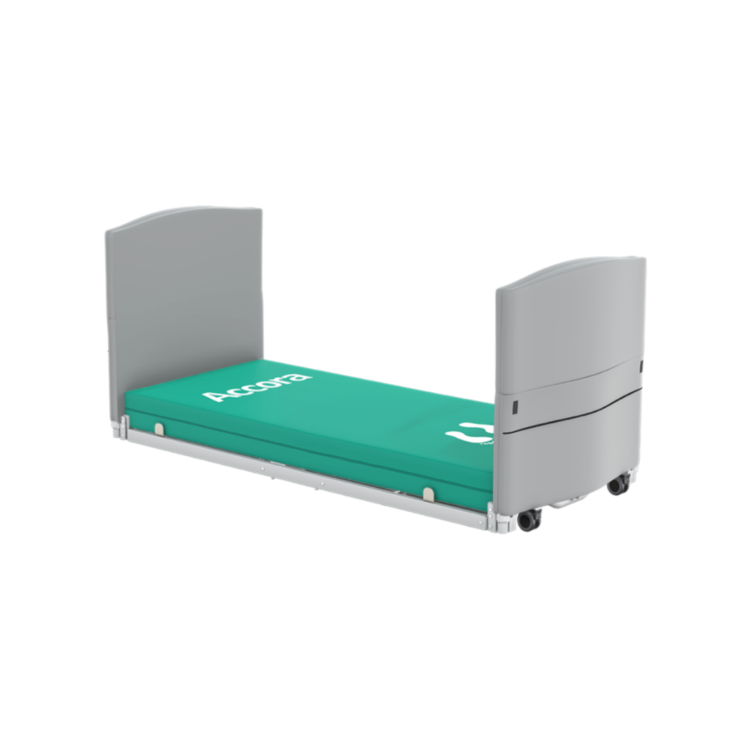 A low-profile Accora FloorBed1 with a green mattress and light gray Bumpers For Head & Footboards, designed for accessibility, safety, and fall prevention.