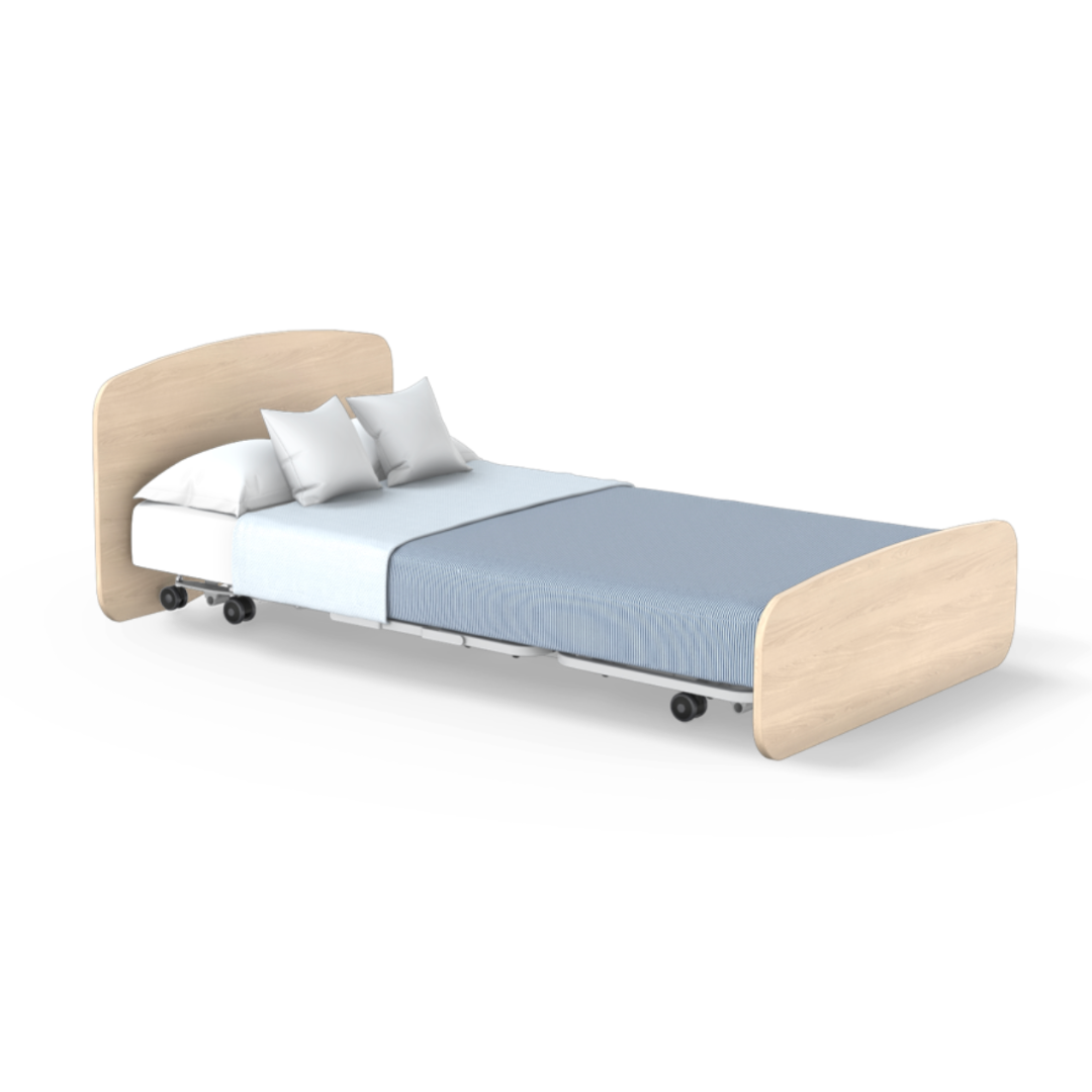The Accora Empresa® Full Electric Bariatric FloorBed® is a modern single bed with a light wood headboard and footboard, white pillows, crisp sheets, a soft blue blanket, and bottom wheels for easy mobility.