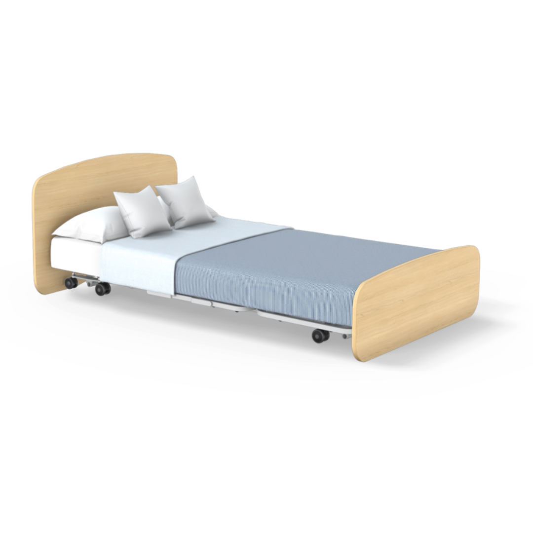 The Accora Empresa® Full Electric Bariatric FloorBed® features a light wood headboard and footboard, blue blanket, white sheet, two white pillows, and a wheeled frame for easy mobility, shown against a white background.
