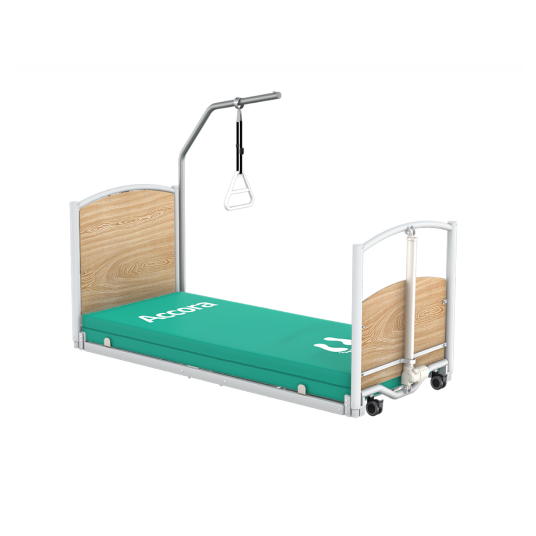 A Trapeze Self-Assist Pole for Accora Beds is mounted above a low-profile Accora Empresa bed with light wood head and footboards, featuring a teal "Accora" mattress to enhance user mobility and support.