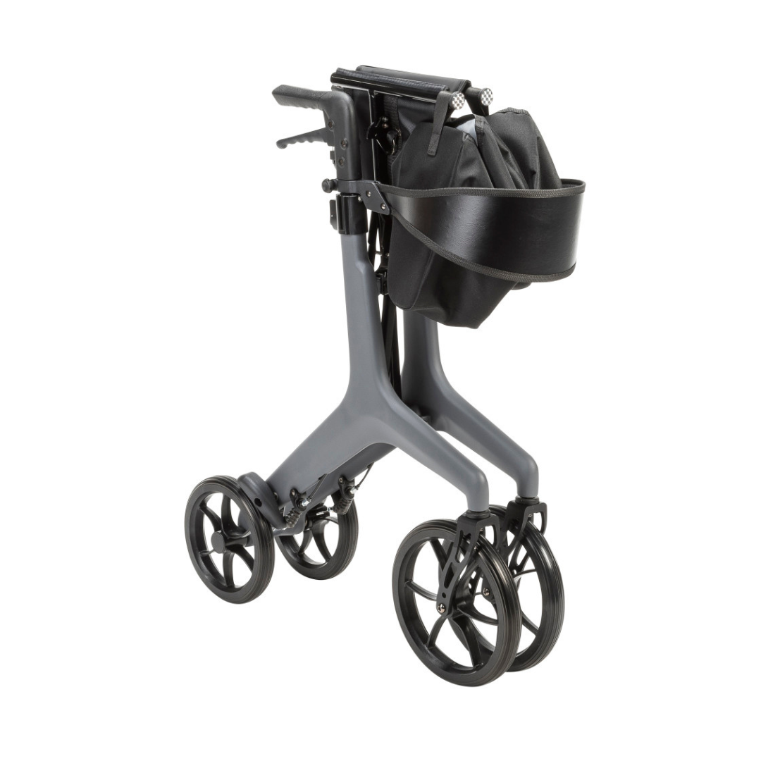 The Drive AeroCarbon Ultra-Lite Rollator is a modern, ultra-light gray rollator with four large wheels, hand brakes, a black storage bag, and a detachable black tray, shown folded for compact storage.