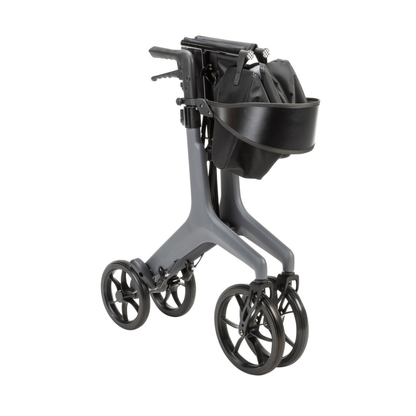 The Drive AeroCarbon Ultra-Lite Rollator is a modern, ultra-light gray rollator with four large wheels, hand brakes, a black storage bag, and a detachable black tray, shown folded for compact storage.