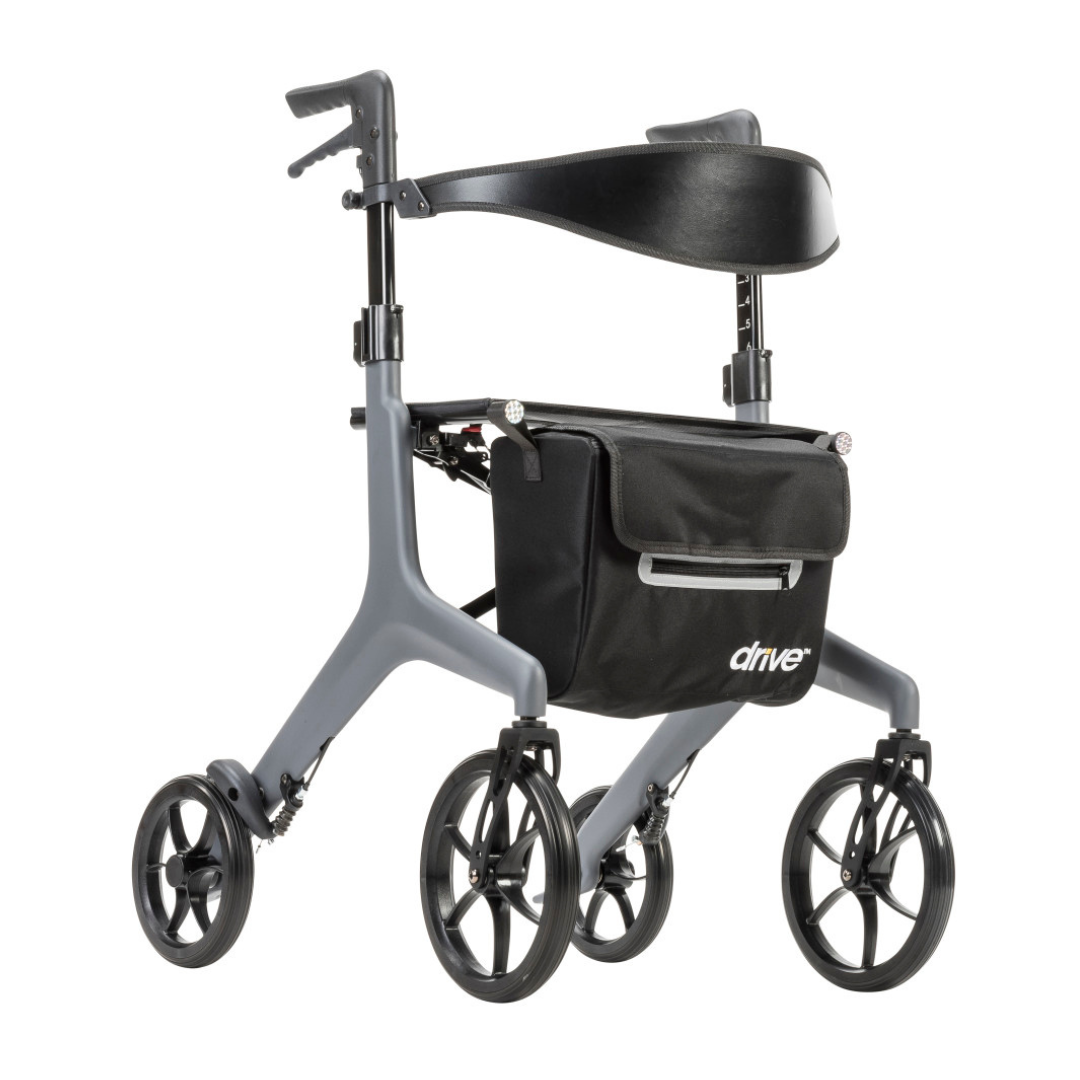 The Drive AeroCarbon Ultra-Lite Rollator is an ultra-light gray rollator with four large black wheels, ergonomic handles, a curved black backrest, compact folding design, and a convenient front black storage bag labeled "drive.