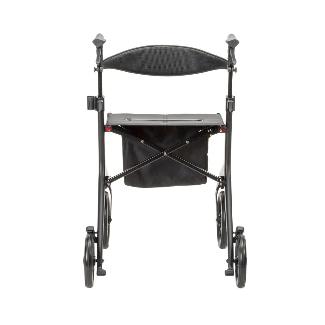 The Drive AeroCarbon Ultra-Lite Rollator in black, featuring four wheels, a seat, backrest, and an under-seat storage pouch, is shown from the front on a white background.