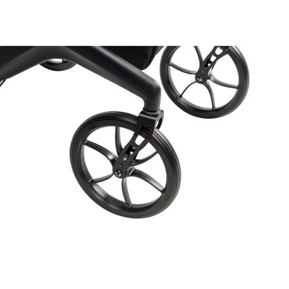 Close-up of two black wheels with slim spokes attached to the Drive AeroCarbon Ultra-Lite Rollator’s bottom frame, featuring a compact folding design, shown against a white background.