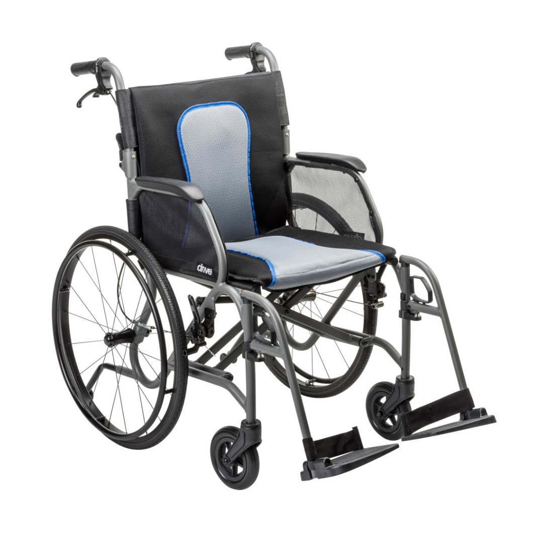 The Drive AeroFly™ Ultra-Lite Wheelchair with Companion Brakes is an ultra-lightweight wheelchair featuring large rear wheels, small front wheels, armrests, footrests, a gray magnesium alloy frame, and black/light blue padded seating.