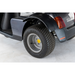 Close-up of a black scooters rear wheel and tire on white background, featuring a textured tread pattern. Afikim Electric Vehicle Accessories enhance the body design, including a reflective red strip near the wheel.