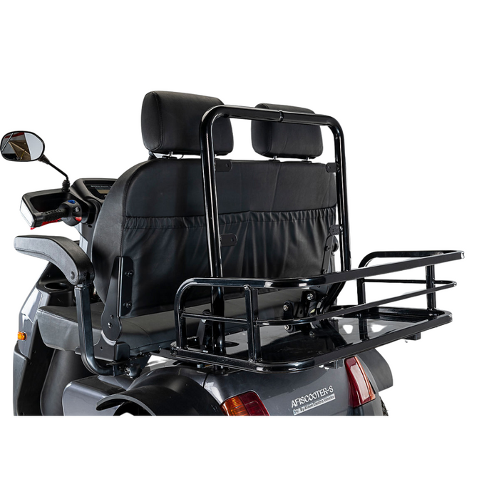 The Afikim Electric Vehicle Accessories include a mobility scooter featuring a rear luggage carrier, black seat with two headrests, visible handlebars, and a left mirror. Its metallic carrier has a sturdy framework ensuring daily durability.