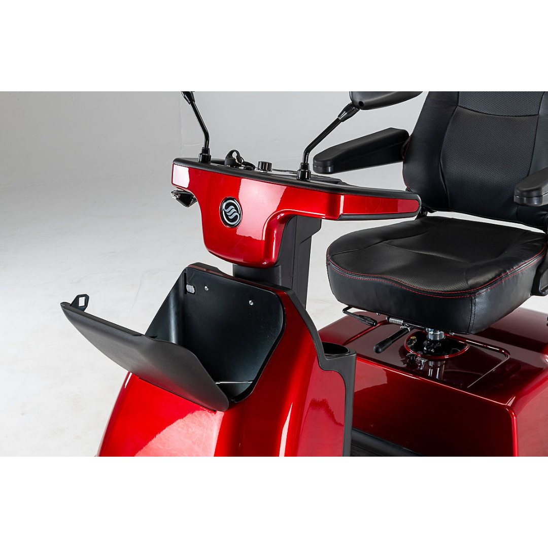 The Afikim Afiscooter C4 HD 4-Wheel Mobility Scooter is red with a black orthopedic seat and armrests. It includes handlebars with mirrors, a front storage compartment, and boasts a sleek, modern design. The scooter is displayed on a white background.