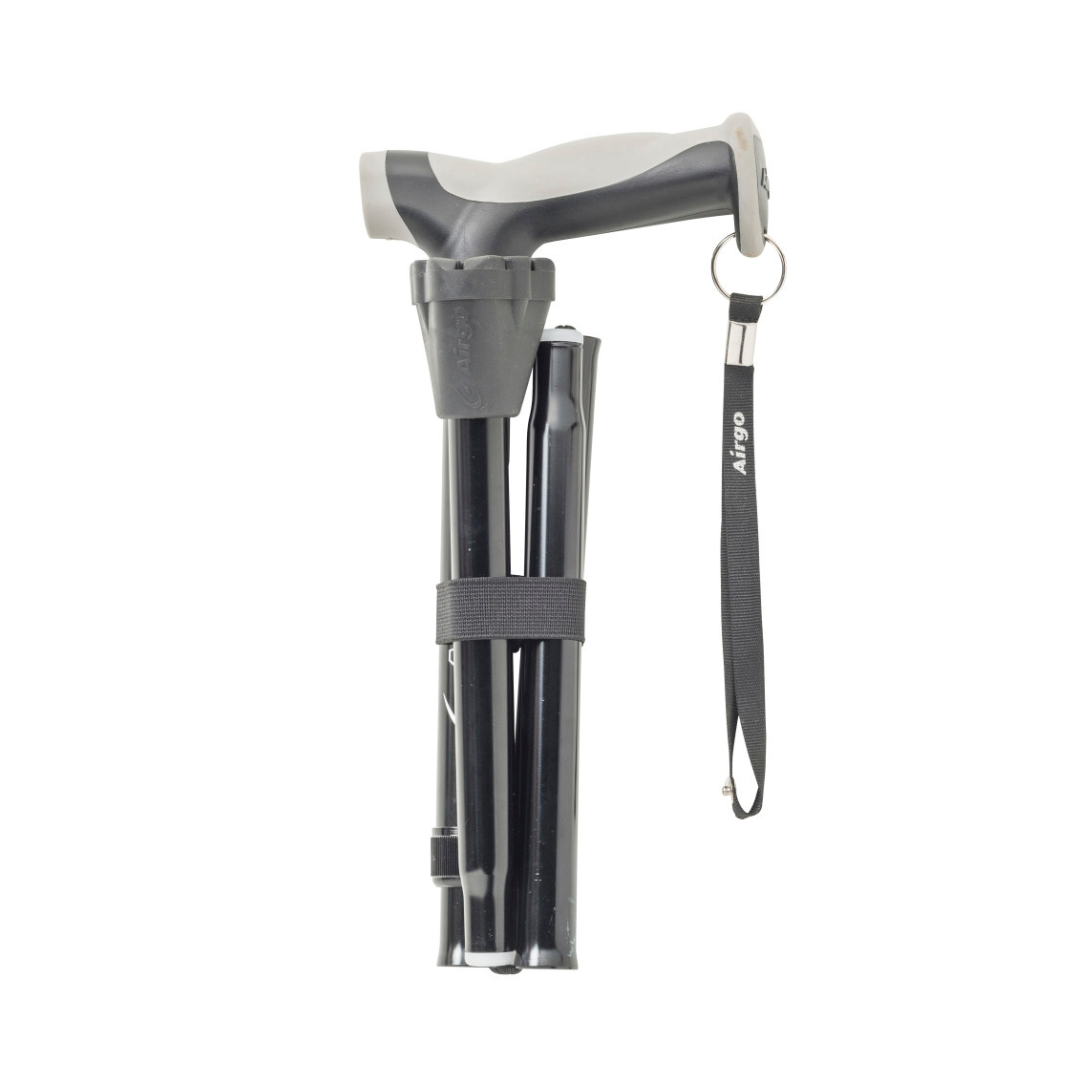 The Drive Airgo Comfort-Plus Folding Cane in black features a grey ergonomic arthritis-friendly handle, a secure black wrist strap, and folds compactly with a Velcro strap.