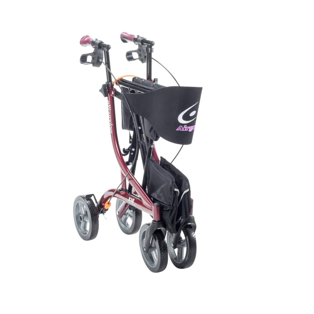 A red Drive Airgo eXcursion X18 Lightweight Hemi-Height Rollator with a black bag.