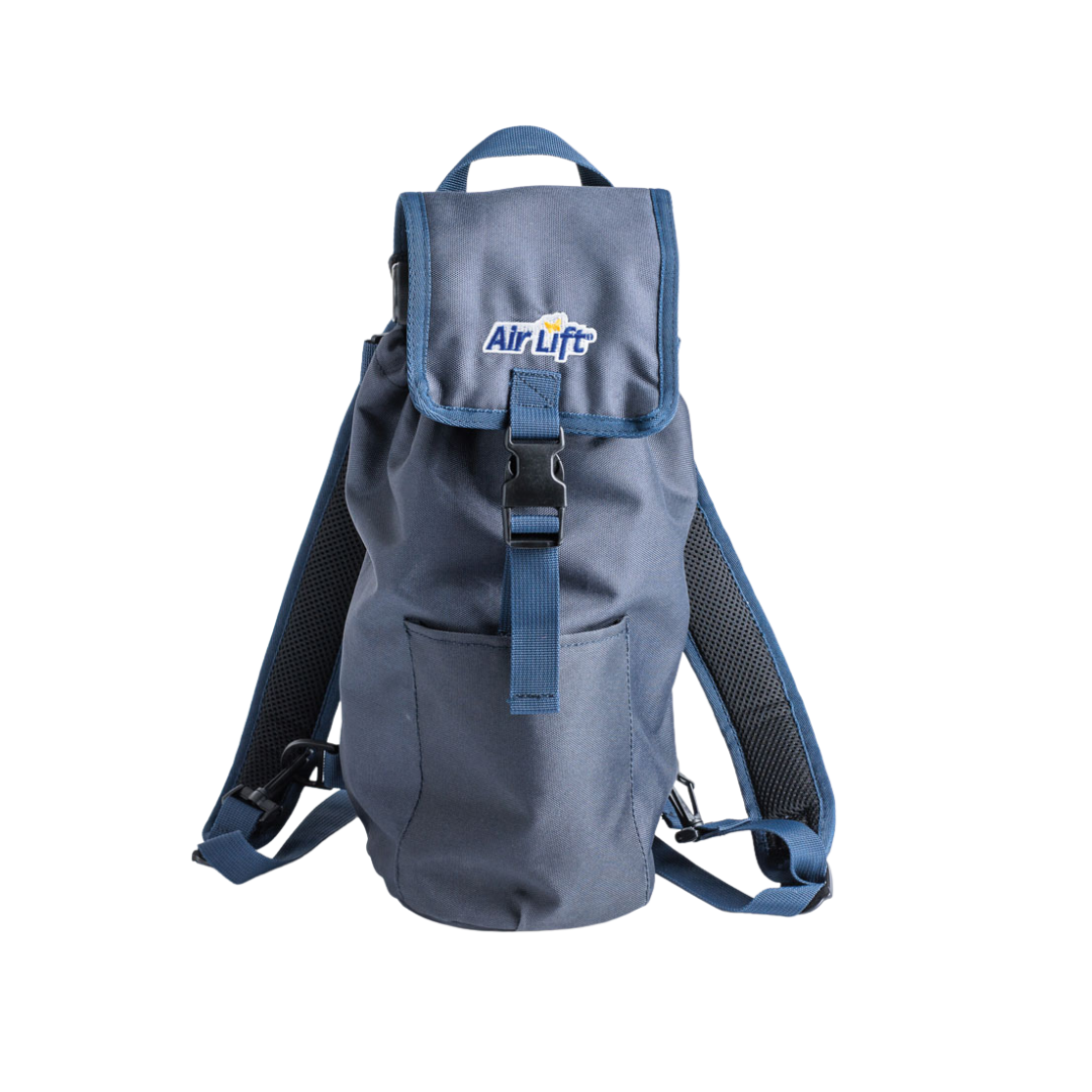 The Air Lift Backpack for Oxygen D Cylinders is blue with adjustable straps, a front pocket, and a top flap with a buckle. The white and yellow AirLift logo is on the flap. It’s shown against a white background.