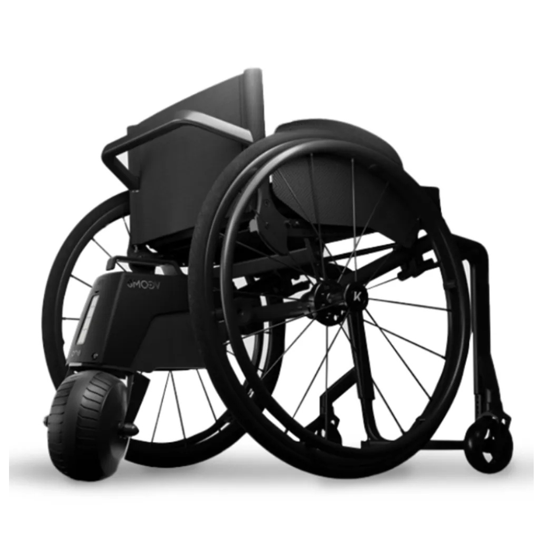 The Alber SMOOV One Power Assist is shown on a modern black wheelchair with large rear wheels and a sleek minimalist design, displayed against a white background.