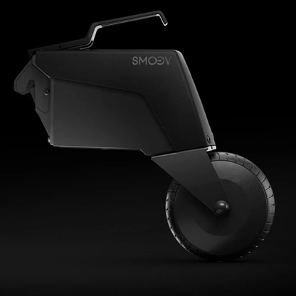 The Alber SMOOV One Power Assist, a sleek black electric drive attachment with SMOOV branding for wheelchairs, is displayed against a dark background.