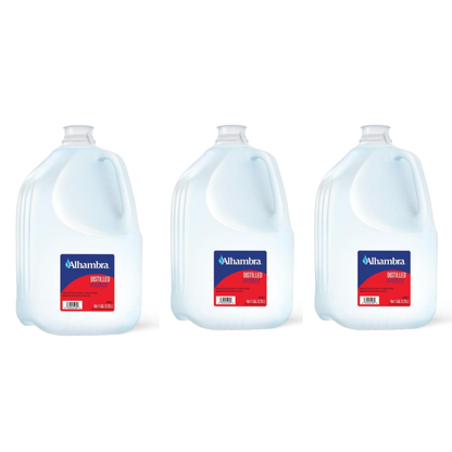 Three 1-gallon jugs of Alhambra Distilled Water with blue and red labels are lined up against a white background. A convenient hydration choice from WATER SOURCE ONE.