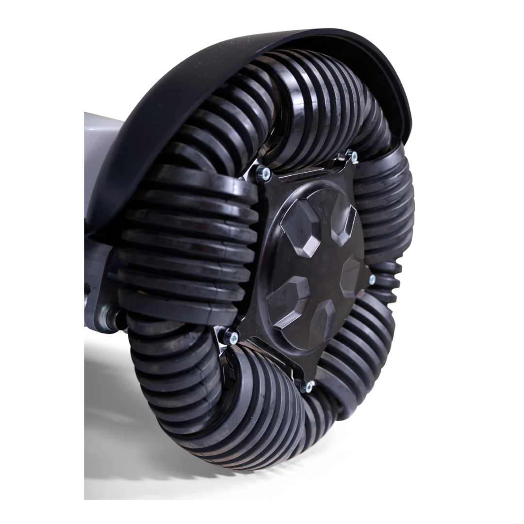 Close-up of a black segmented omni wheel with curved rubber sections and silver bolts, designed for multi-directional movement on the Golden Tech Ally Sport Smart Powerchair with app control. The background is white.