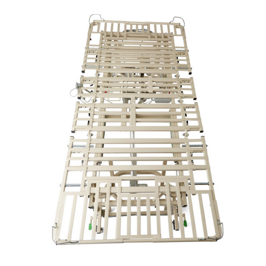 A beige Medline Alterra Maxx Long-Term Care Hi/Low Hospital Bed frame with metal slats (no mattress) is shown from above. Features include side rails, a 5-function hand pendant, adjustable width/length, electronic controls, and caster wheels.