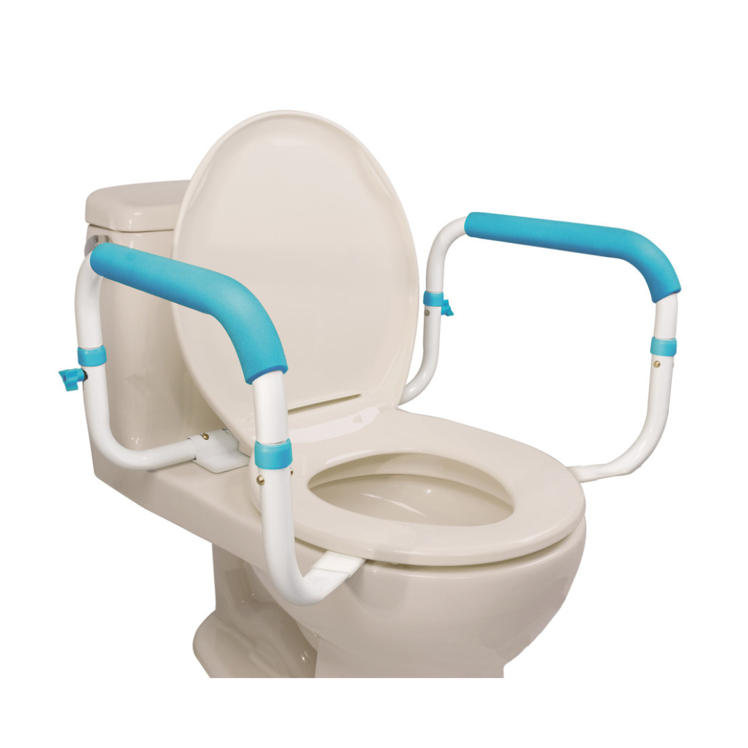 The Drive AquaSense Toilet Safety Rails feature white safety rails with blue cushioned grips and a heavy-duty steel frame, offering extra support for users when sitting or standing at a standard white toilet.