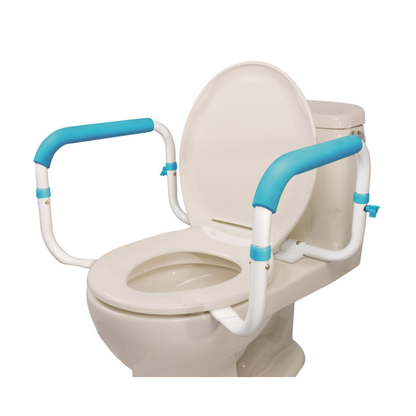 A white toilet with the lid open features Drive AquaSense Toilet Safety Rails—white support rails with blue padded grips on each side—designed to assist individuals with mobility issues.