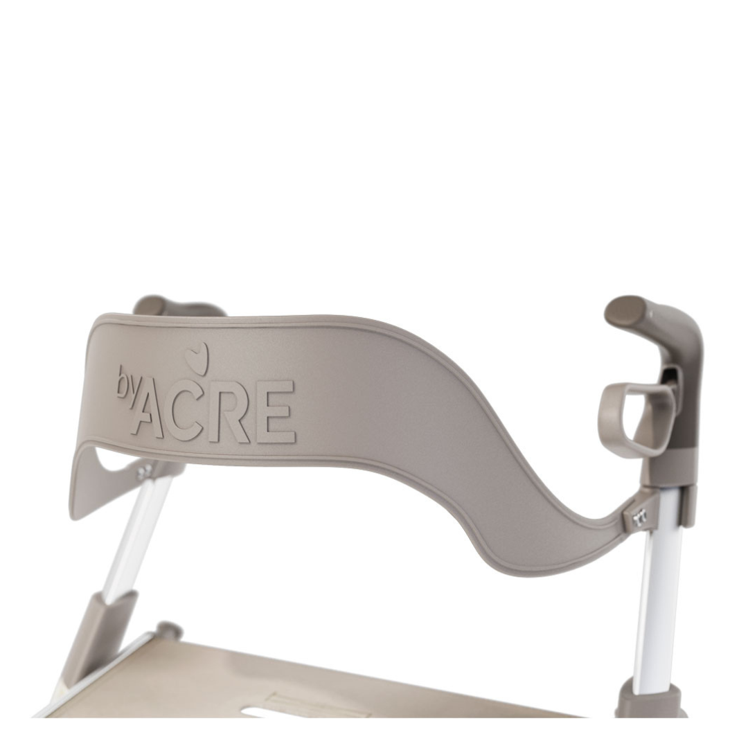 Close-up of the Backrest for ByAcre Ultralight Carbon Fiber Rollators, featuring embossed byACRE text on gray plastic, attached to a rollator frame against a white background.
