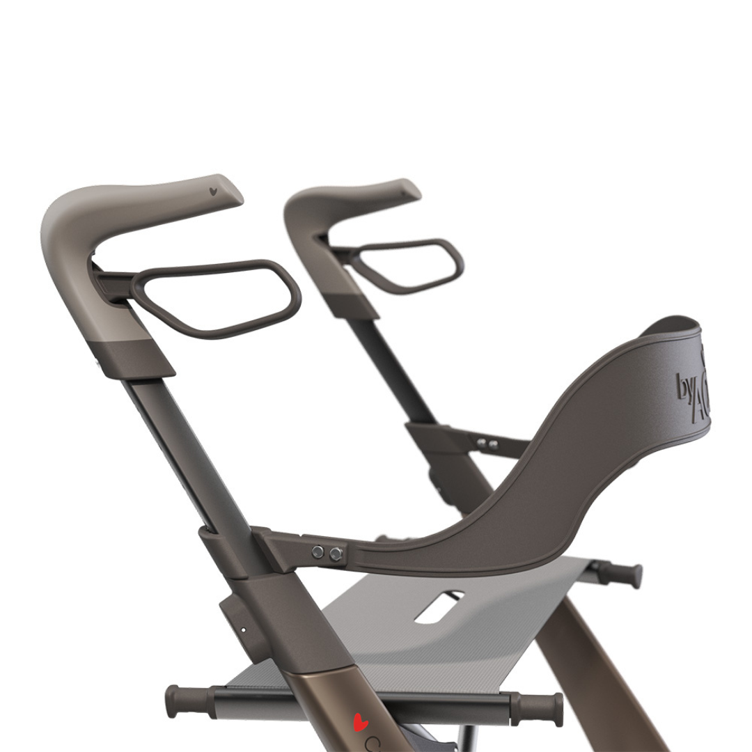 Close-up of a modern brown high chair featuring the Backrest For byAcre Overland Carbon Fiber Rollators for comfort. Its sleek frame resembles an Overland Rollator with side handles and a mesh platform below the seat.