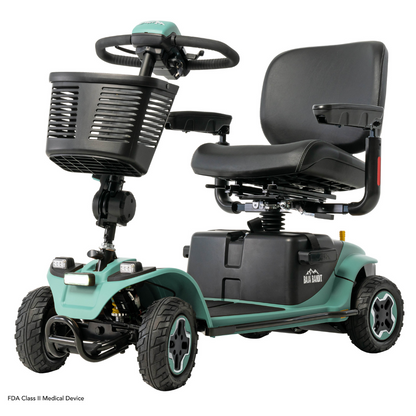 The Pride Baja® Bandit 4 Wheel Scooter offers a green mobility solution with a black seat, basket, handlebar, and four wheels. Designed for accessibility, it features a rugged base, full suspension, compact design, and lithium-ion power for smooth off-road rides across diverse terrains.