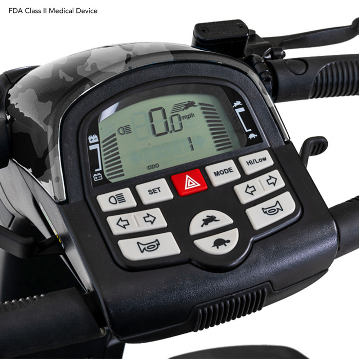 Close-up of the Pride Baja® Wrangler® 2 Heavy Duty Outdoor Scooters control panel, displaying 0 mph with buttons for speed, mode settings, and headlight. Handle grips and mirrors partially visible. This outdoor scooter features CTS Suspension and is labeled as an FDA Class II Medical Device.