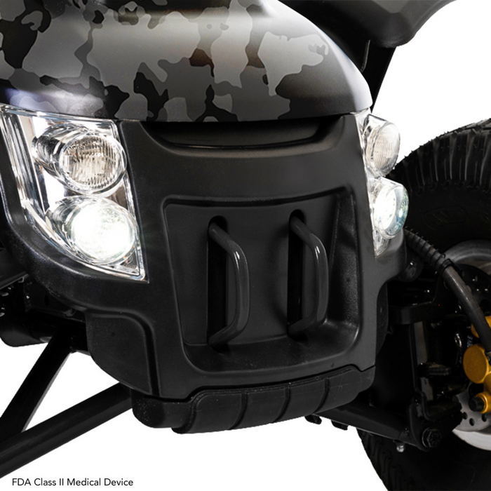 Close-up of the Pride Baja® Wrangler® 2 outdoor scooters camo patterns. It boasts CTS Suspension, large wheels, bright headlights, and a robust bumper with handles. Text below indicates it is an FDA Class II Medical Device.